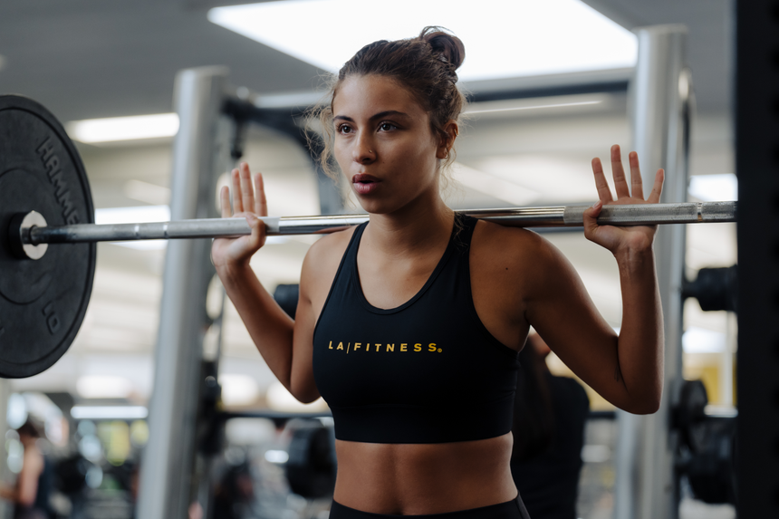 photo of compression bra 2.0 in black with la fitness logo on front in yellow