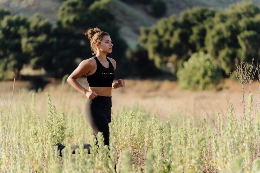 photo of compression bra 2.0 in black with la fitness logo on front in yellow